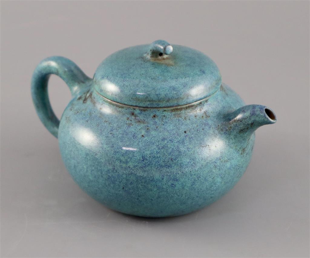 A Chinese Yixing robins-egg glazed compressed globular teapot and cover, Qing dynasty, 17.5cm across